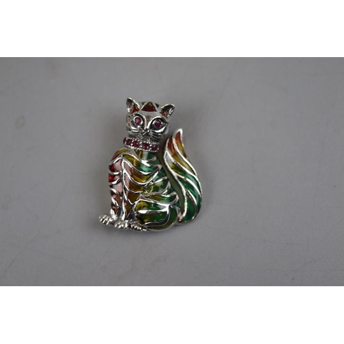 50 - Silver enamel and ruby set cat brooch