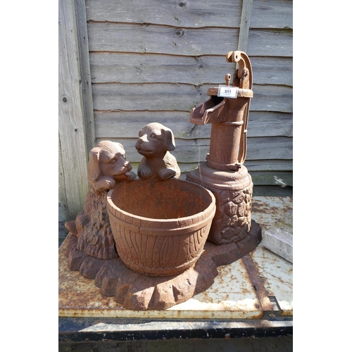 511 - Cast iron water pump featuring puppies