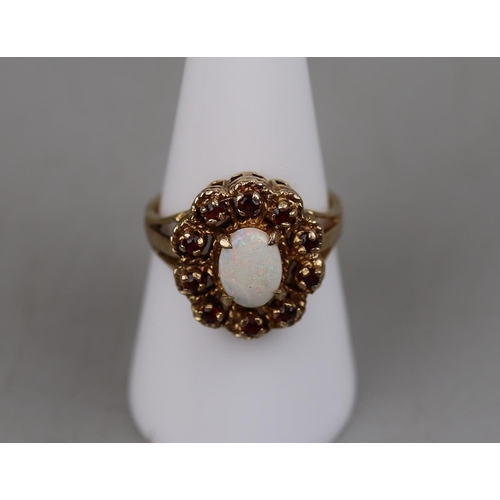 64 - Gold garnet and opal set ring - Approx. size: P