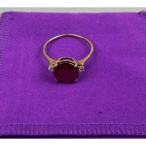 76 - Gold ruby and white zircon ring together with gold and silver pendant on gold chain