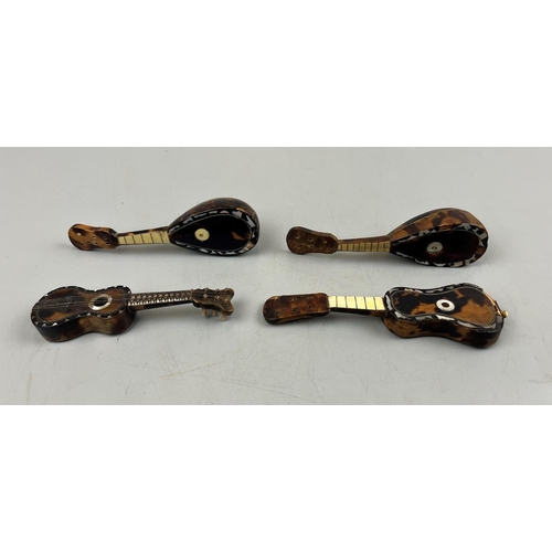 94 - 4 miniature tortoise-shell & mother of pearl musical instruments