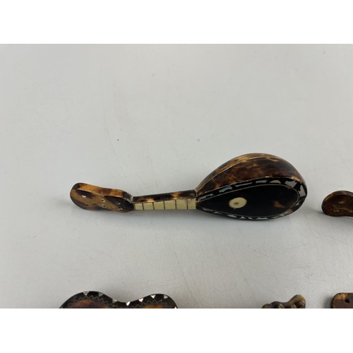 94 - 4 miniature tortoise-shell & mother of pearl musical instruments