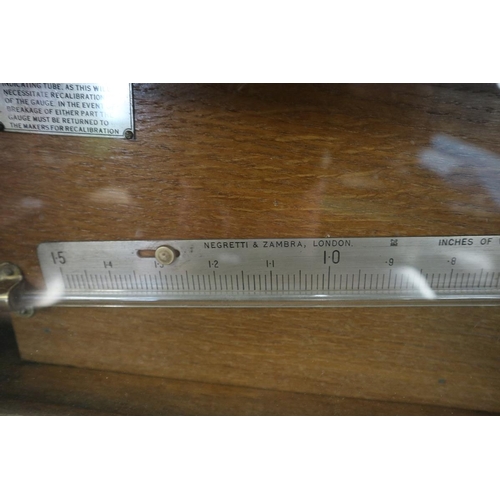 131 - Rain water gauge by Negretti & Zambra
