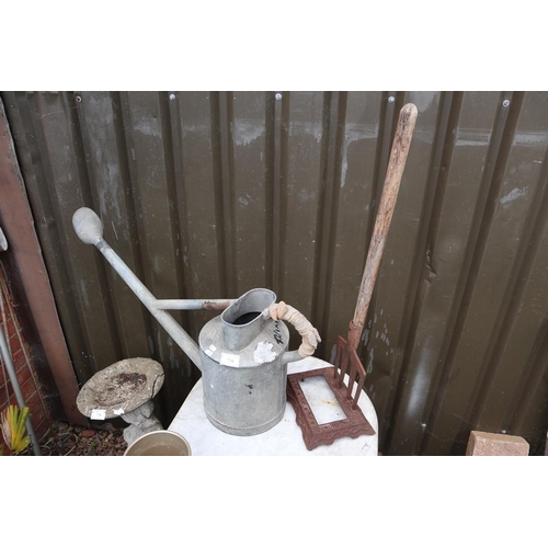 376 - Good quality galvanised watering can together with a boot scrape