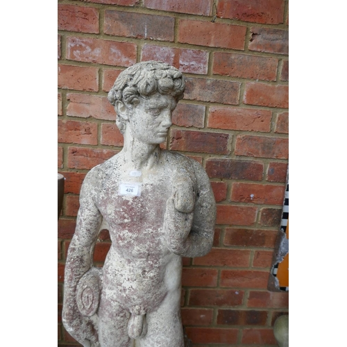 426 - Large stone statue of David on plinth - Approx height: 162cm