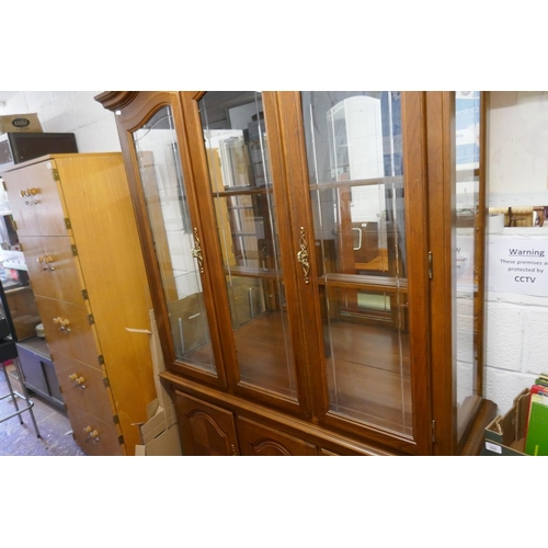 232 - Large glazed display cabinet on base - Approx size: W: 132cm D: 44cm H: 214cm