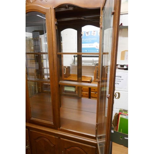 232 - Large glazed display cabinet on base - Approx size: W: 132cm D: 44cm H: 214cm