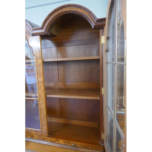 253 - Queen Anne style walnut 2 domed bookcase with a glazed top - Approx size: W: 110cm D: 40cm H: 200cm