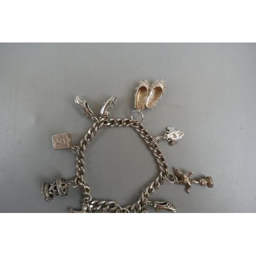 31 - Silver charm bracelet