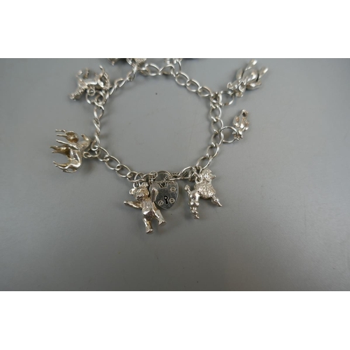 32 - Silver charm bracelet