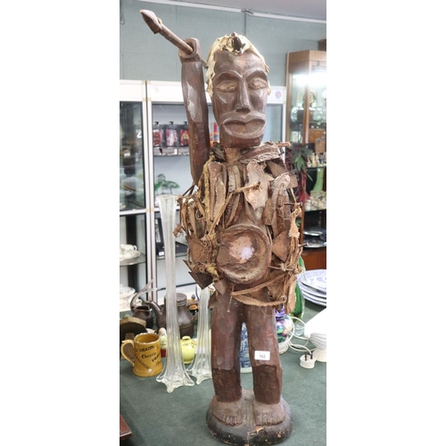 162 - Interesting carved tribal figure adorned with bones etc - Approx height: 104cm