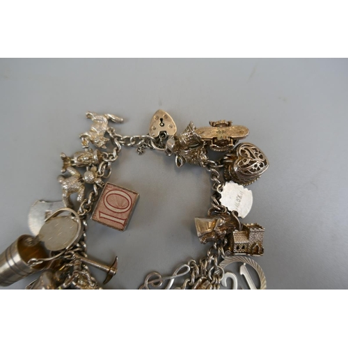 32 - Silver charm bracelet - Approx weight: 71g