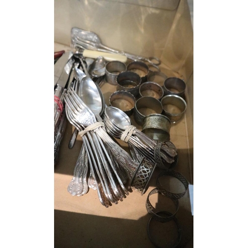 121 - Collection of flatware to include napkin rings and Le Creuset bottle opener