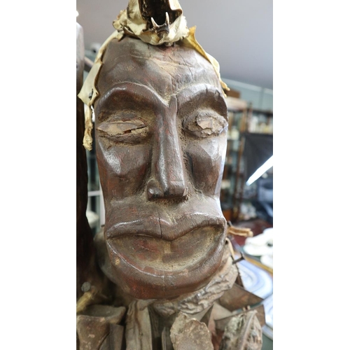 162 - Interesting carved tribal figure adorned with bones etc - Approx height: 104cm