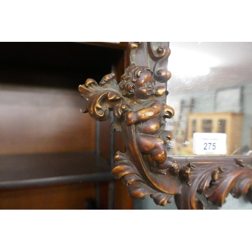 275 - Ornate mirror adorned with cherubs