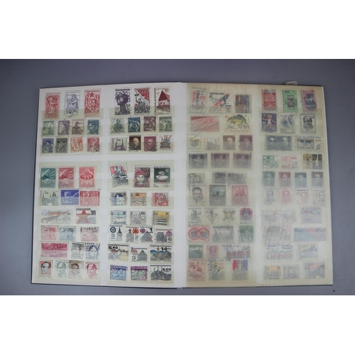 86 - 3 stamp albums and a collection of loose postcards