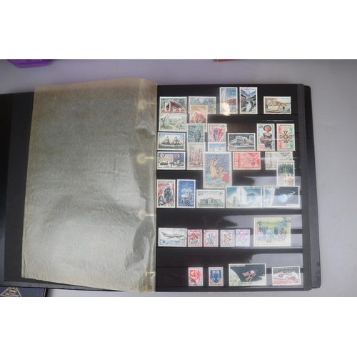 86 - 3 stamp albums and a collection of loose postcards