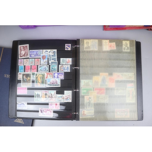 86 - 3 stamp albums and a collection of loose postcards