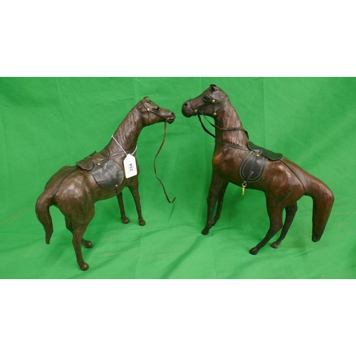 334 - 2 Liberty style leather model horses - Approx height of tallest: 35cm