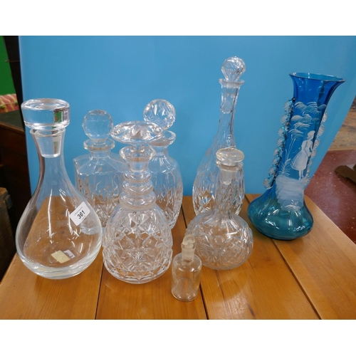 361 - Collection of decanters together with a blue and white vase