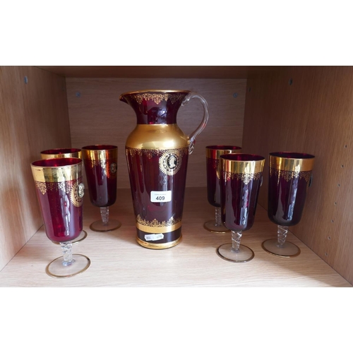 409 - Gilt cranberry glass lemonade set for 6