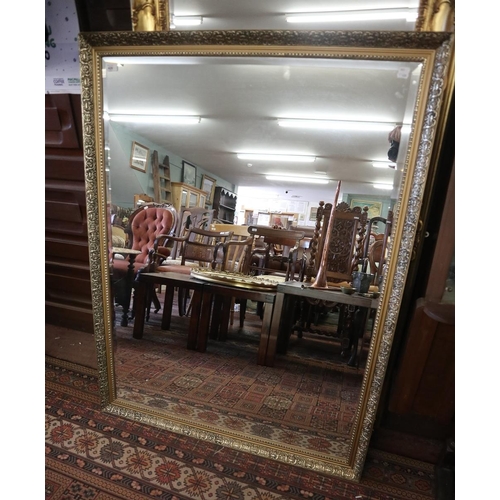 437 - Large bevelled glass mirror in ornate gilt frame