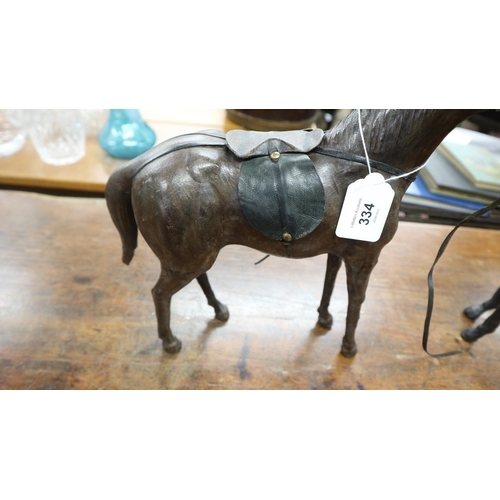 334 - 2 Liberty style leather model horses - Approx height of tallest: 35cm