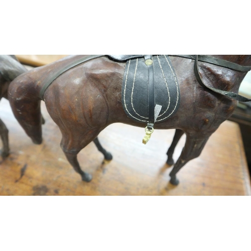 334 - 2 Liberty style leather model horses - Approx height of tallest: 35cm