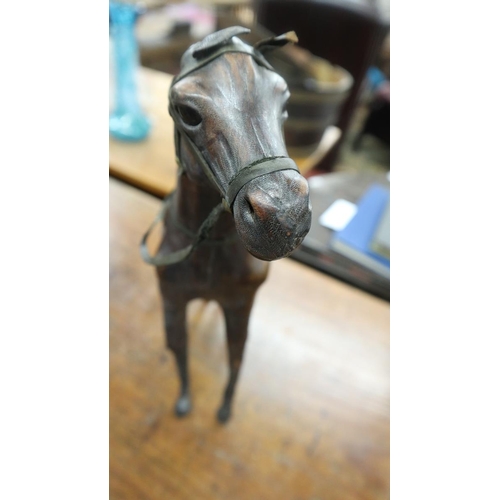 334 - 2 Liberty style leather model horses - Approx height of tallest: 35cm