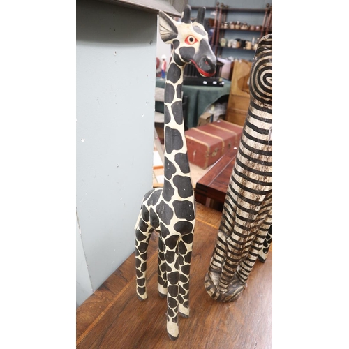 349 - Pair of carved giraffes together with carved cat - Approx height of tallest: 60cm