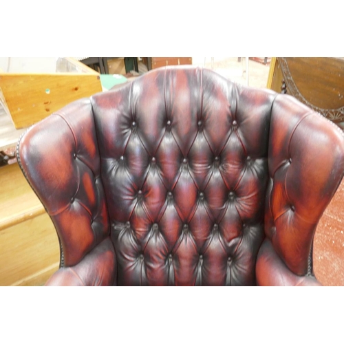 364 - 2 oxblood red leather armchairs