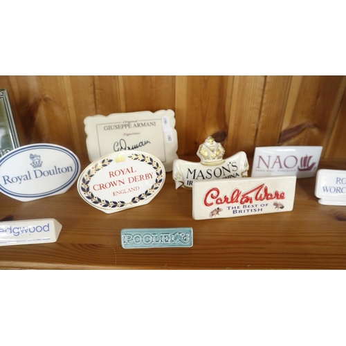 393 - 11 ceramic advertising plaques