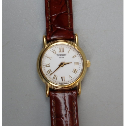 69 - 18ct gold cased Tissot watch with C.O.A