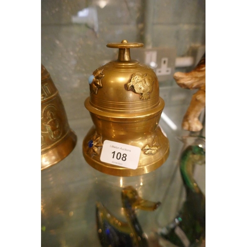 108 - Claw bell on stand together with another bell