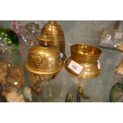 108 - Claw bell on stand together with another bell