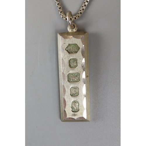 28 - Silver ingot & chain