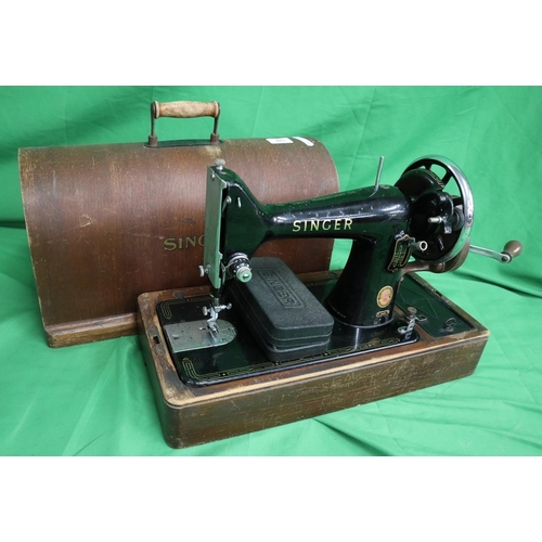 194 - Singer sewing machine together with a sewing table