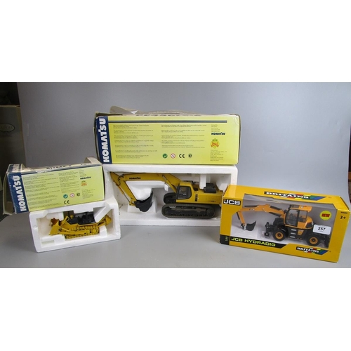 257 - 2 die cast excavators and die cast bull dozer