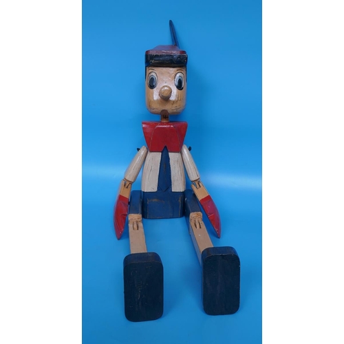 411 - Large articulated wooden figure of Pinocchio - Approx height: 85cm