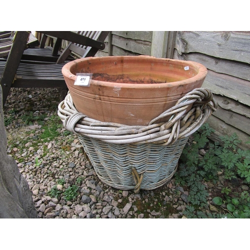 451 - Terracotta pot in basket