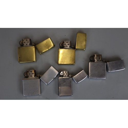 104 - Five Zippo lighters