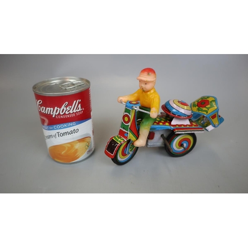 160 - Jaguari man on motorcycle tin plate toy