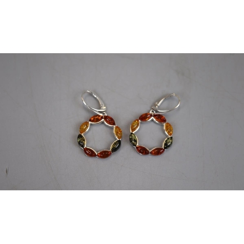 24 - Pair of silver and amber earrings