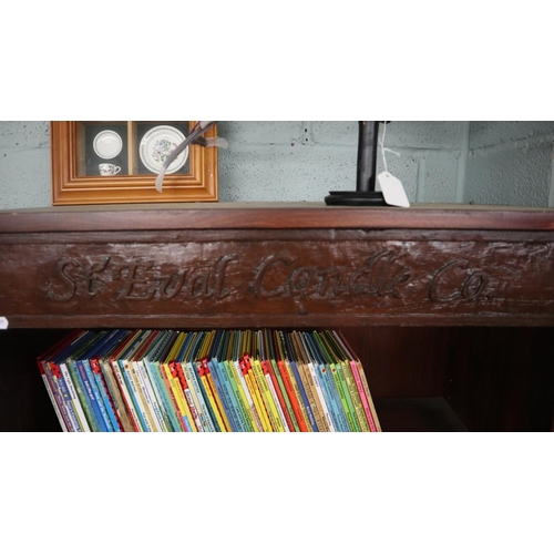 289 - Tall bookcase with carved advertising panel attached - St Eval Candle Co. - Approx size: W: 74cm D:3... 