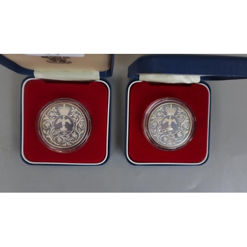 84 - Two silver-proof 1977 silver jubilee coins with C.O.A's