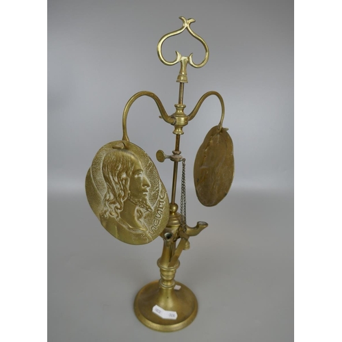 236 - Brass oil lamp depicting Jesus