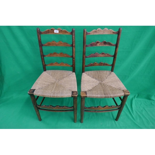 252 - Pair of ladder-back rush seated chairs