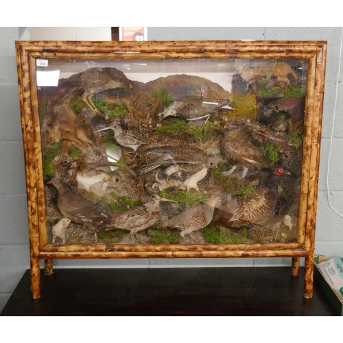 294 - Large British wildlife taxidermy display cabinet to include pheasant, stoat, red squirrel, partridge... 