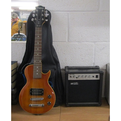 437 - Small electric guitar together with an Acoustic Solutions amplifier