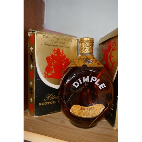 134 - 2 vintage bottles of Dimple whisky in original boxes (levels good) together with Corvorsier brandy m... 